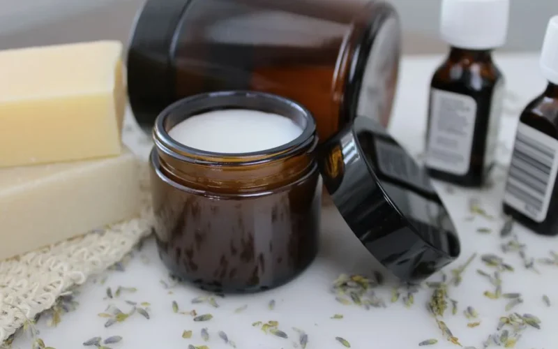 A collection of skincare items featuring natural ingredients in glass containers, perfect for beauty routines.