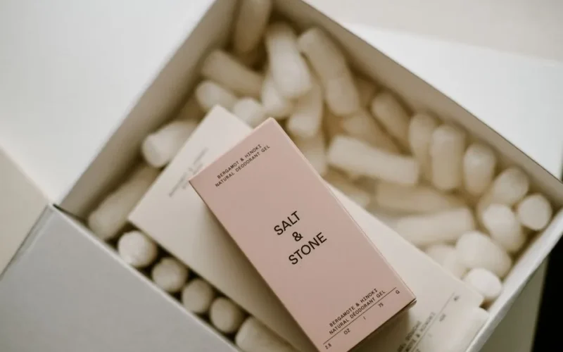 A close-up of Salt & Stone natural deodorant boxes in eco-friendly packaging, perfect for cosmetics advertisement.
