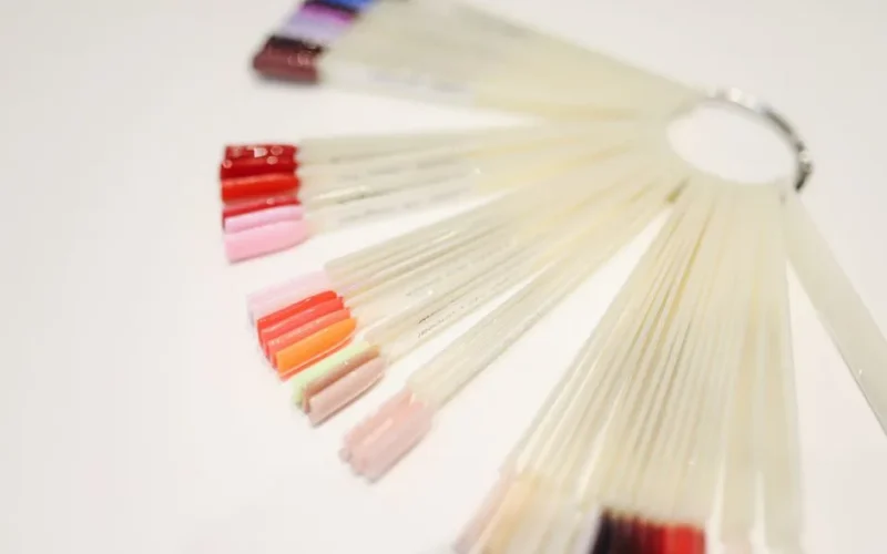 A variety of nail polish samples on display, showcasing vibrant colors for manicure selection.